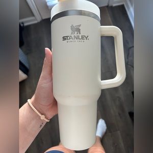 40 ounce cream colored Stanley Cup